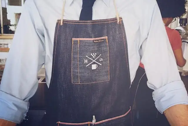 Handsome Coffee Roasters aprons look very Brooks Brothers